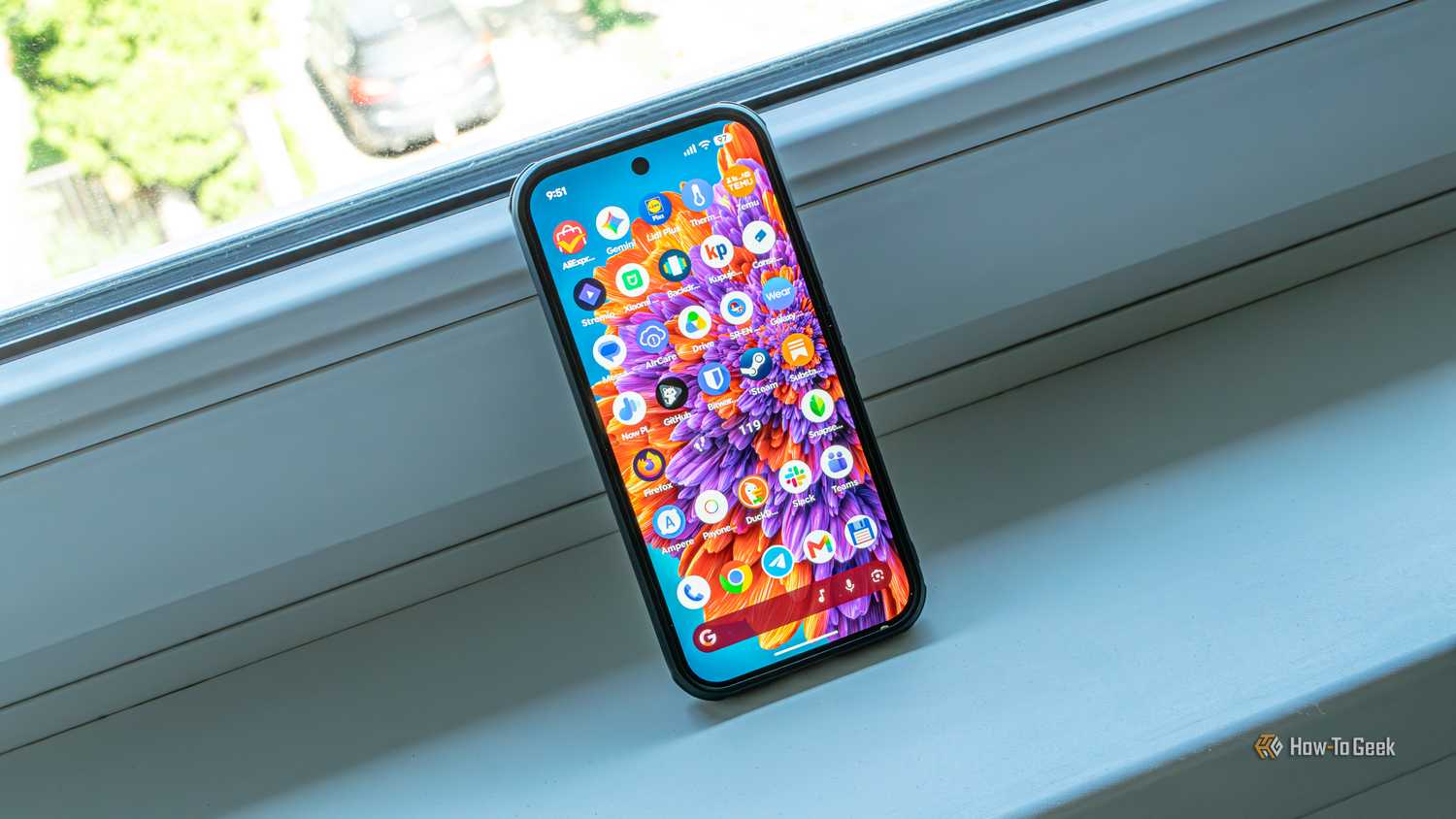 A Pixel 10 Pro resting on a windowsill.