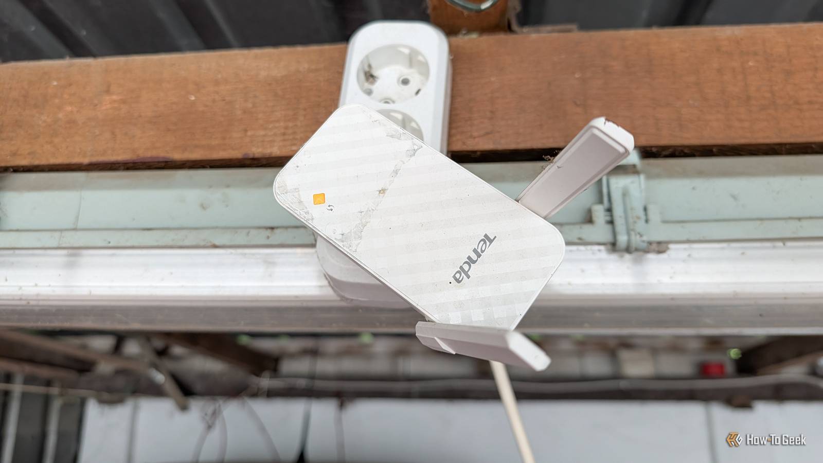 A Wi-Fi Extender plugged into an extension cable.
