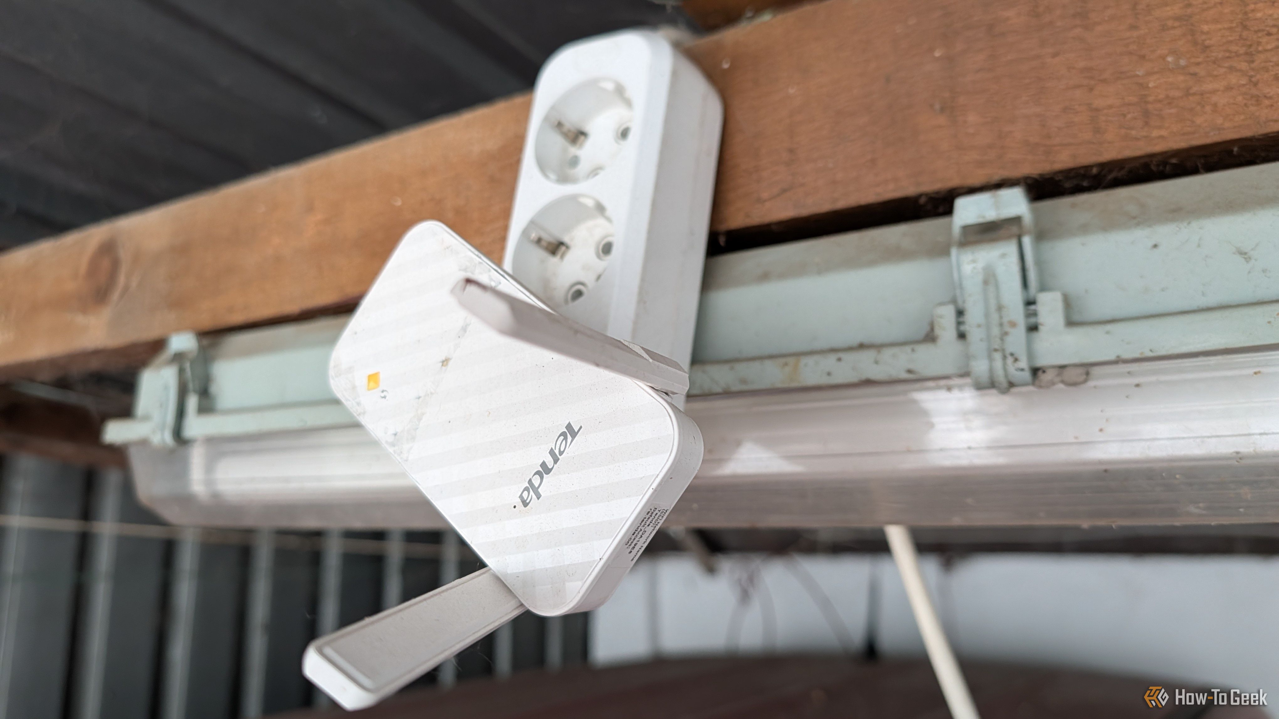 A Wi-Fi Extender plugged into an extension cable.