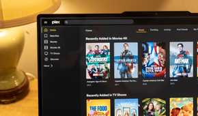 The Plex homepage open showing Marvel movies in 4K and other movies on a laptop screen.