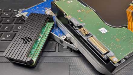A mix of old, rescued computer hardware in a jumbled pile.