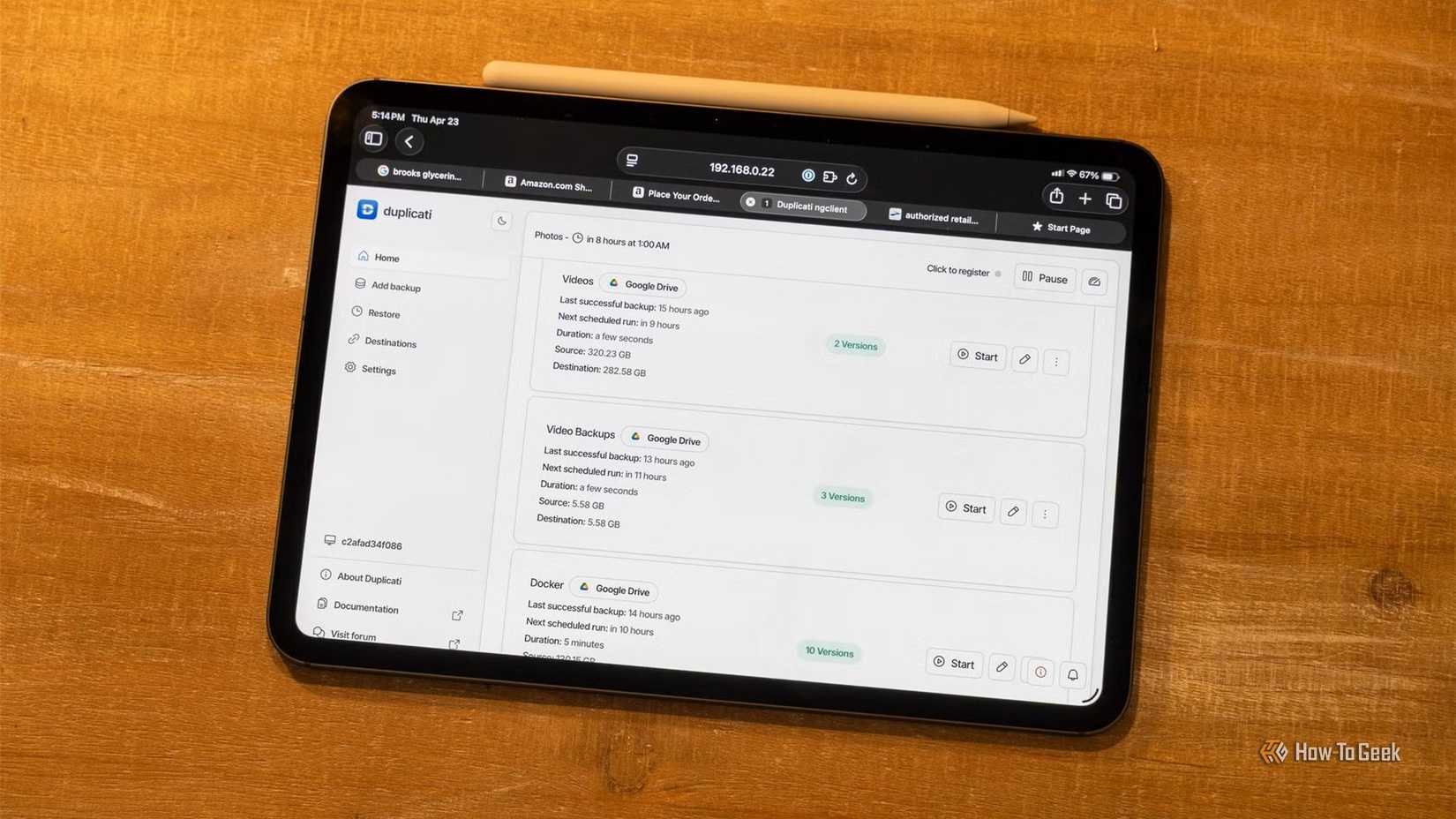 Duplicati's backup interface on an iPad Pro sitting on a wooden background. 