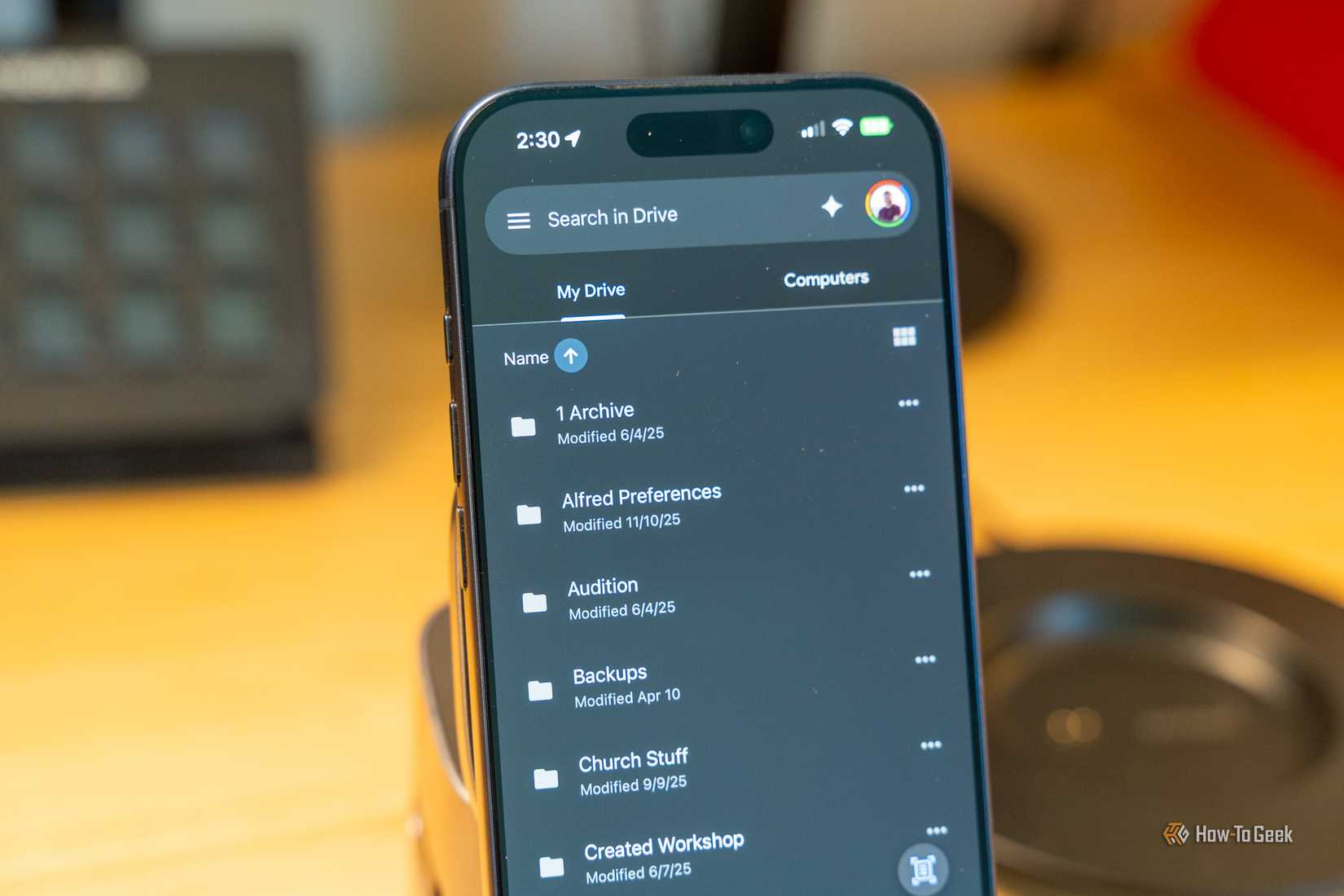 Google Drive on iPhone List of My Drive folders in dark mode.