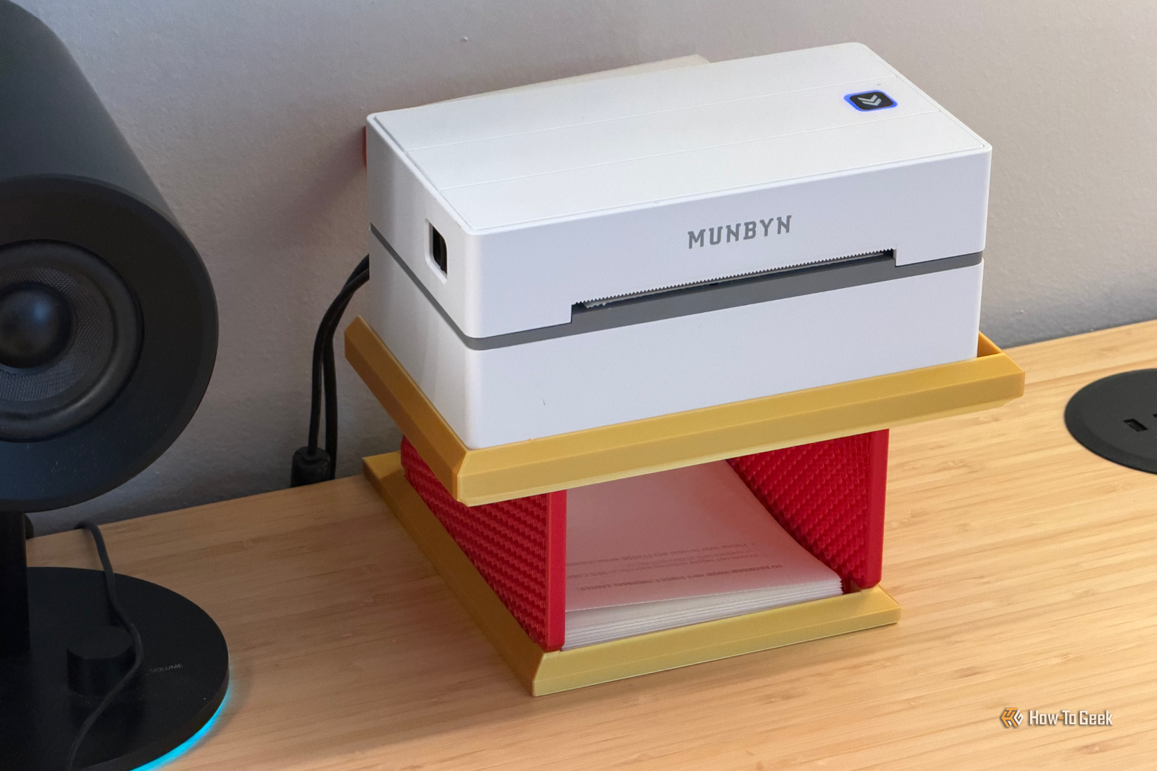 MUNBYN thermal label printer placed on a 3D printed support.
