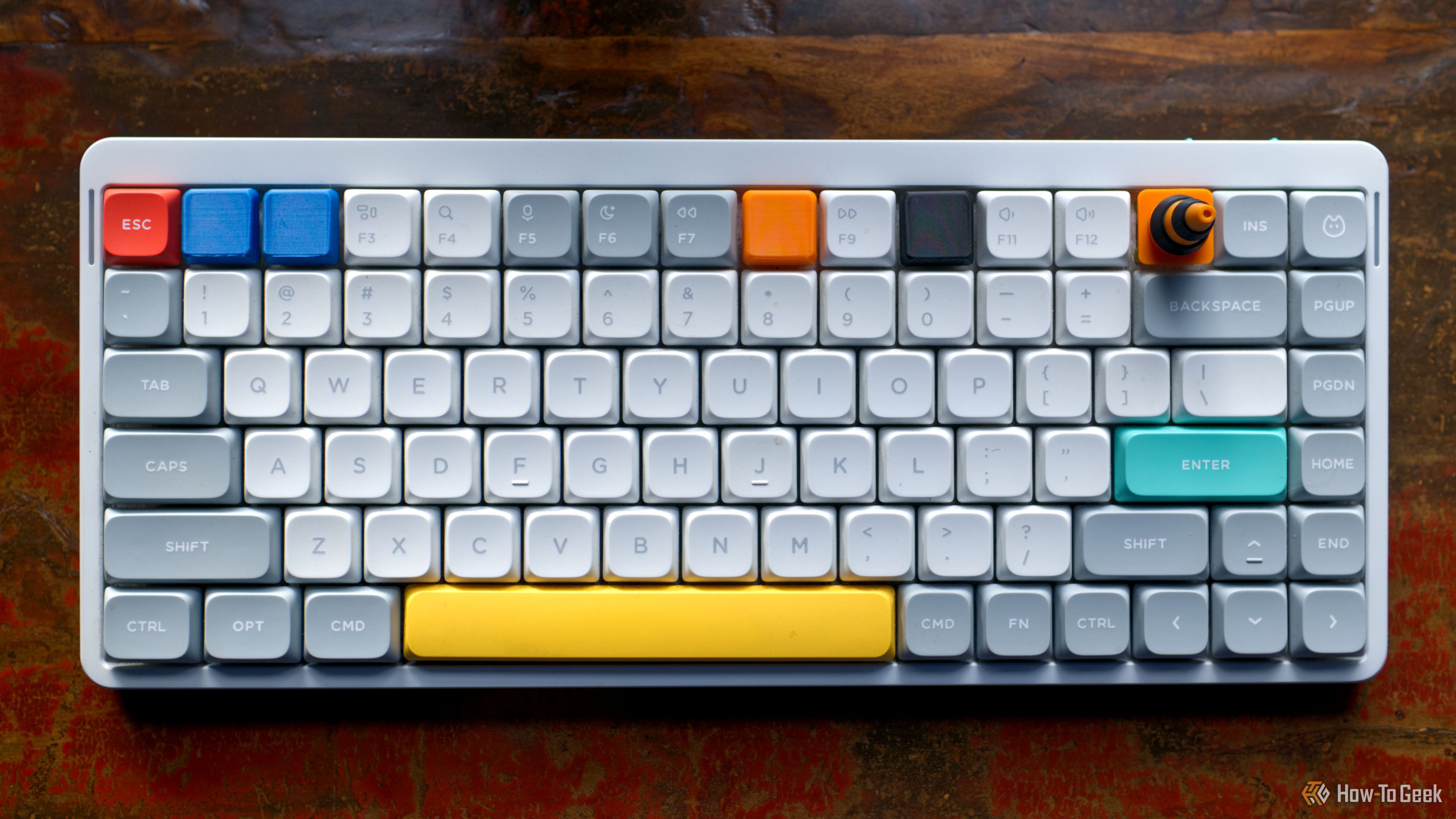 I 3D printed custom keycaps for the function row shortcuts I actually use