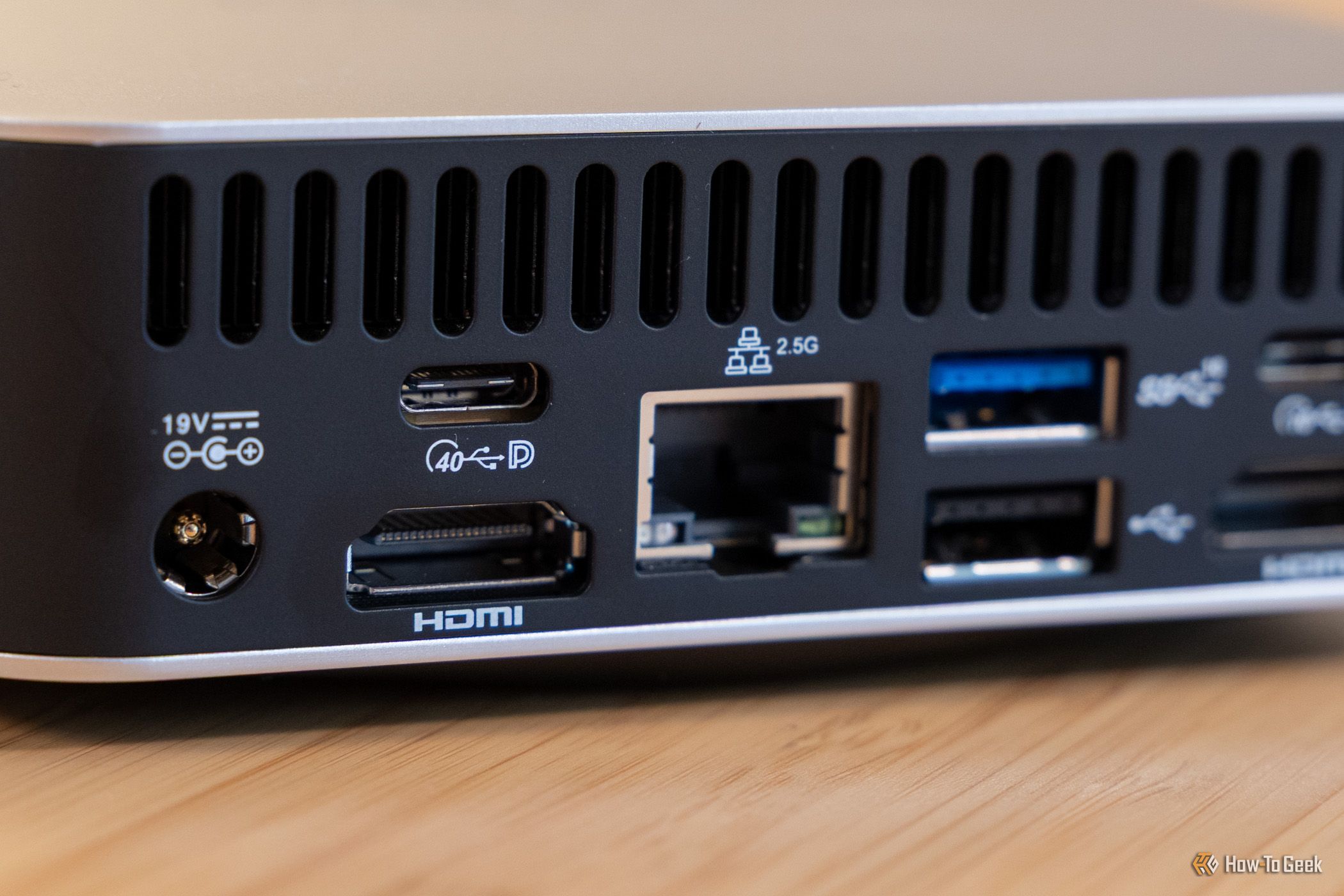 Rear I-O left side with 19V DC power USB-C 40Gbps DisplayPort HDMI 2.5G Ethernet and USB-A 10Gbps.