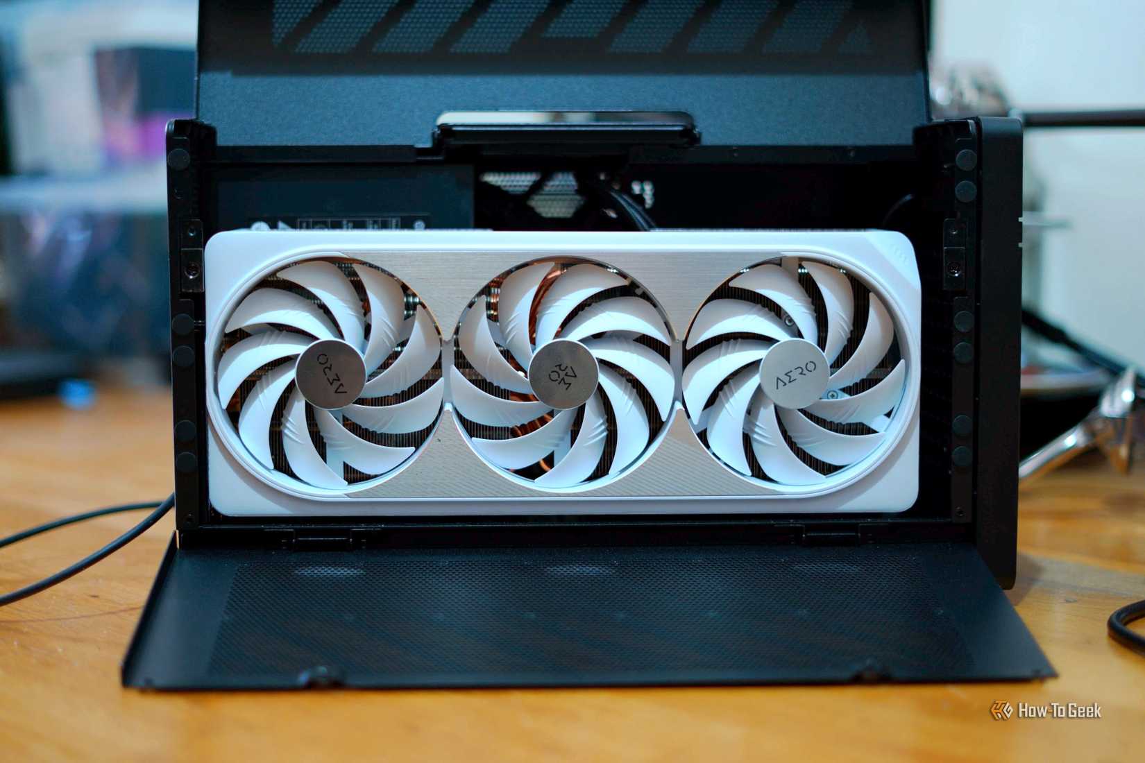 The Plugable TB5 eGPU enclosure on a desk.