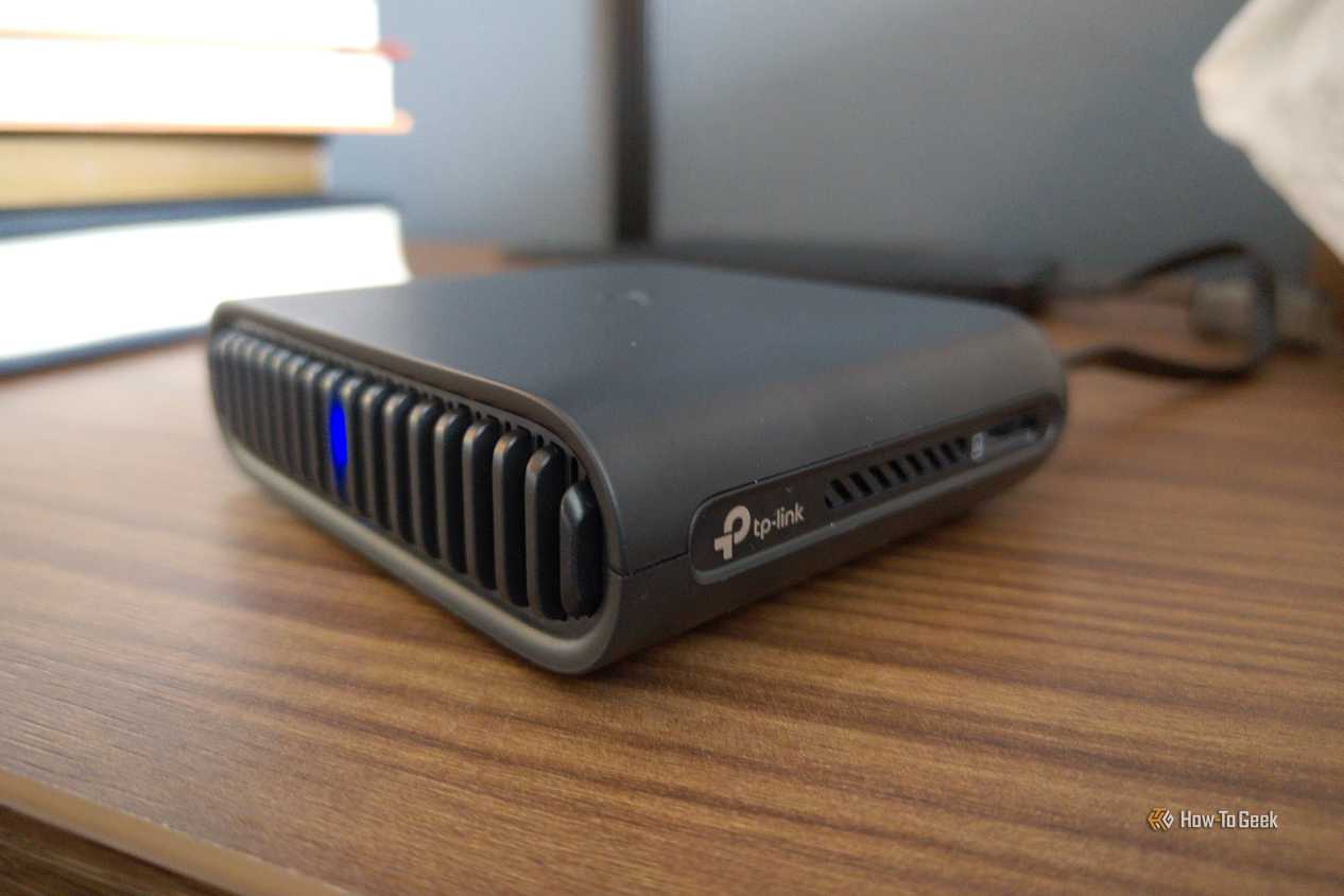 TP-Link logo on a travel router.