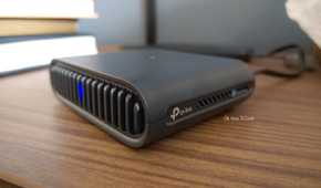 TP-Link logo on a travel router.