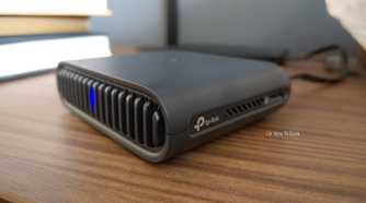TP-Link logo on a travel router.