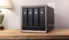 Ugreen DXP4800 GT four-bay NAS front view on desk.