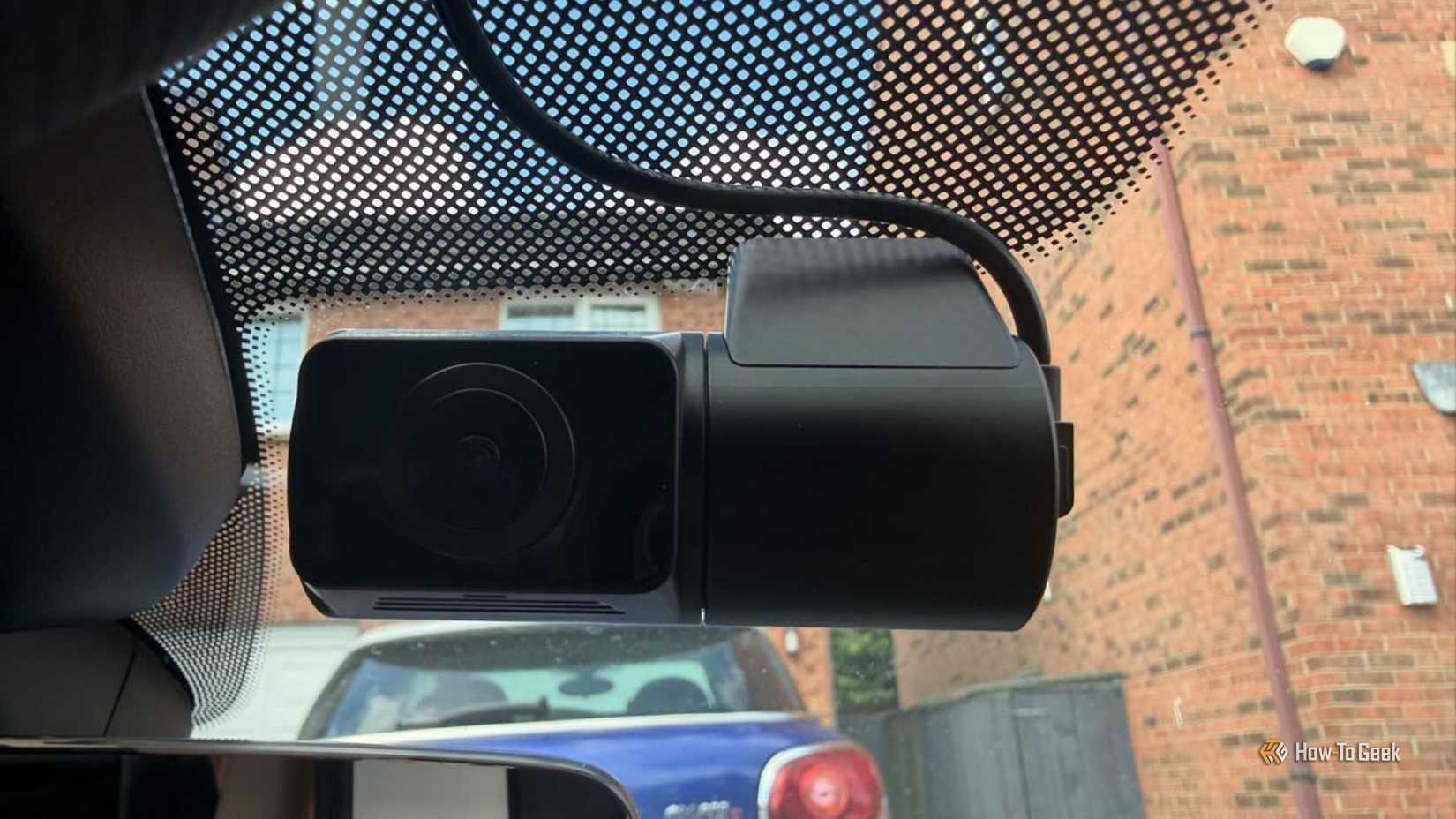 VIOFO A329S 3CH cabin fisheye camera installed near the rearview mirror of a 2017 Audi S5, showing the wide-angle lens, mount, and cable routing against the windshield shade band