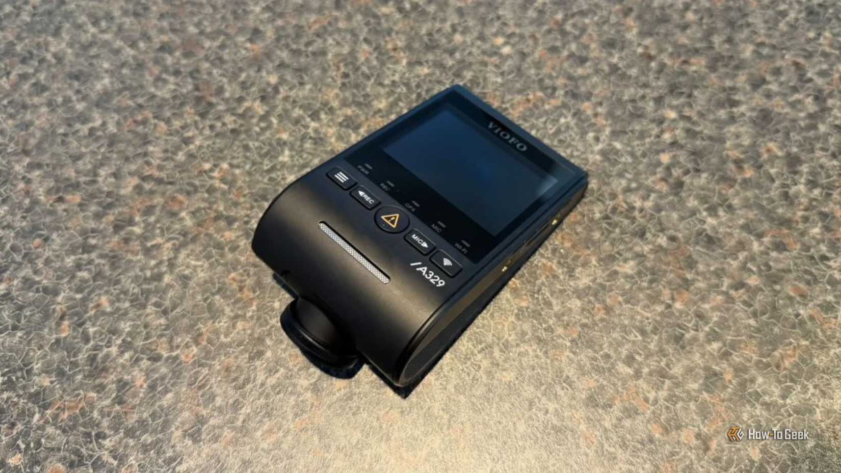 VIOFO A329S 3CH main dashcam unit viewed from above on a granite surface showing the screen, physical buttons, and A329 branding