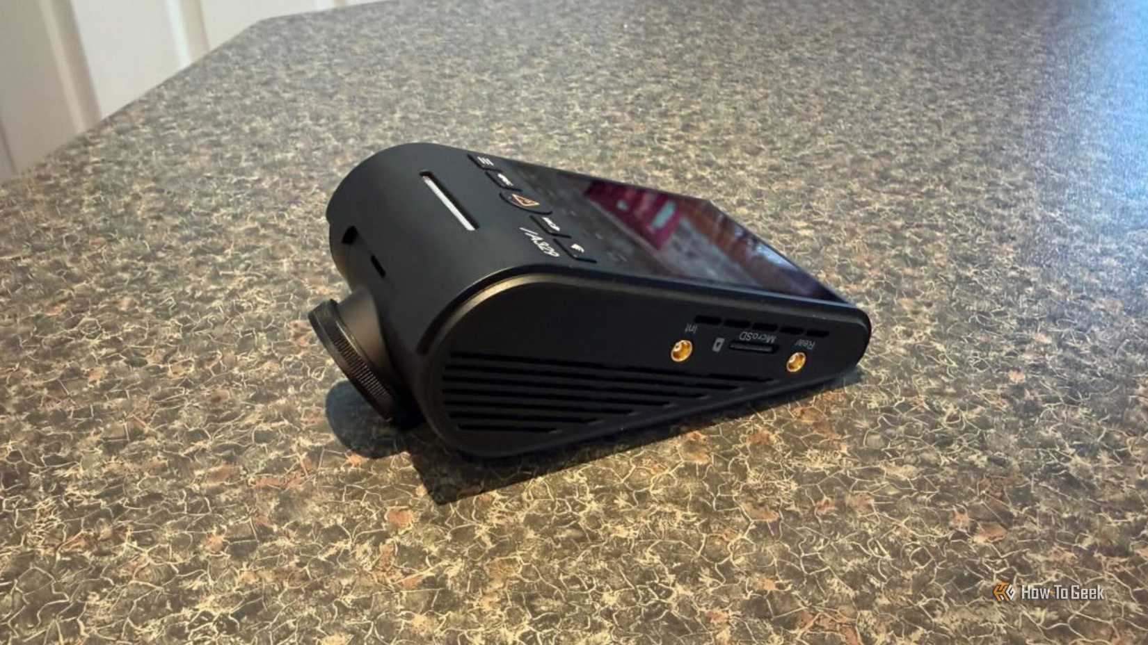 VIOFO A329S 3CH side profile showing two gold-tipped coaxial connectors for the cabin and rear cameras alongside the MicroSD card slot
