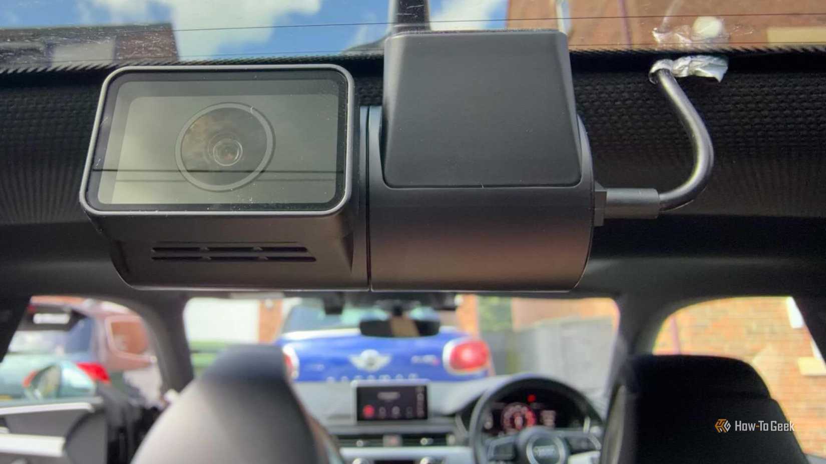 VIOFO A329S 3CH rear camera mounted on the rear windshield of a 2017 Audi S5, viewed from inside the cabin showing the fisheye lens, GPS antenna, and vehicle interior