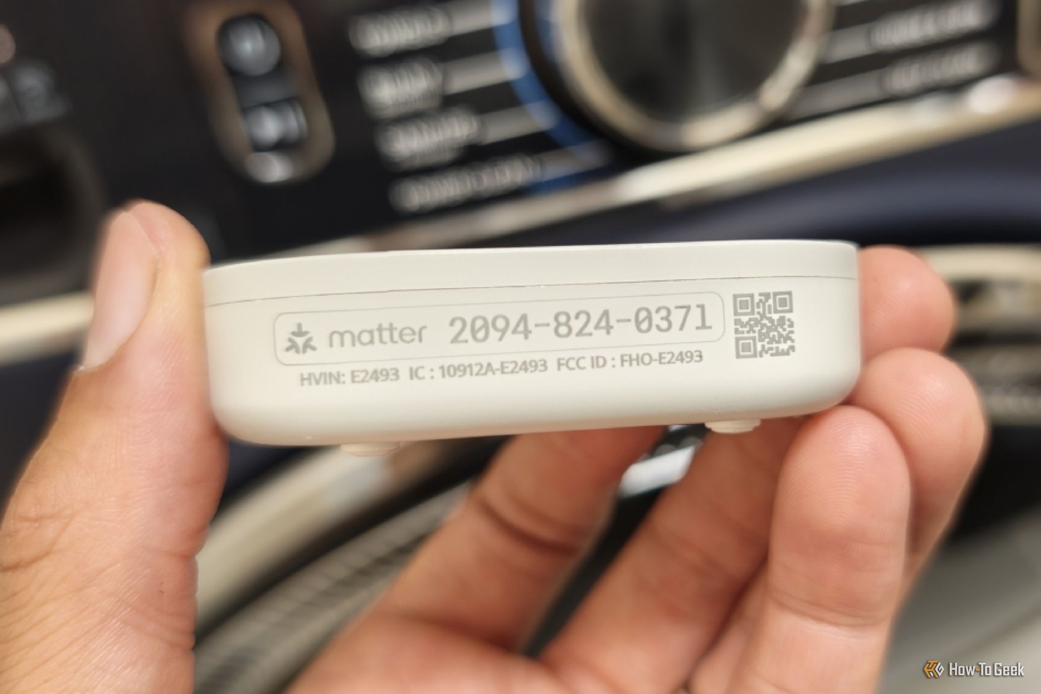 Matter pairing number and QR code on the side of an IKEA KLIPPBOK water leak sensor.
