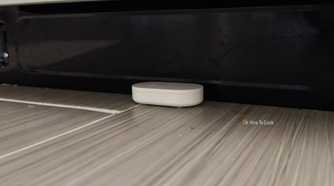 An IKEA KLIPPBOK water sensor underneath a dishwasher.