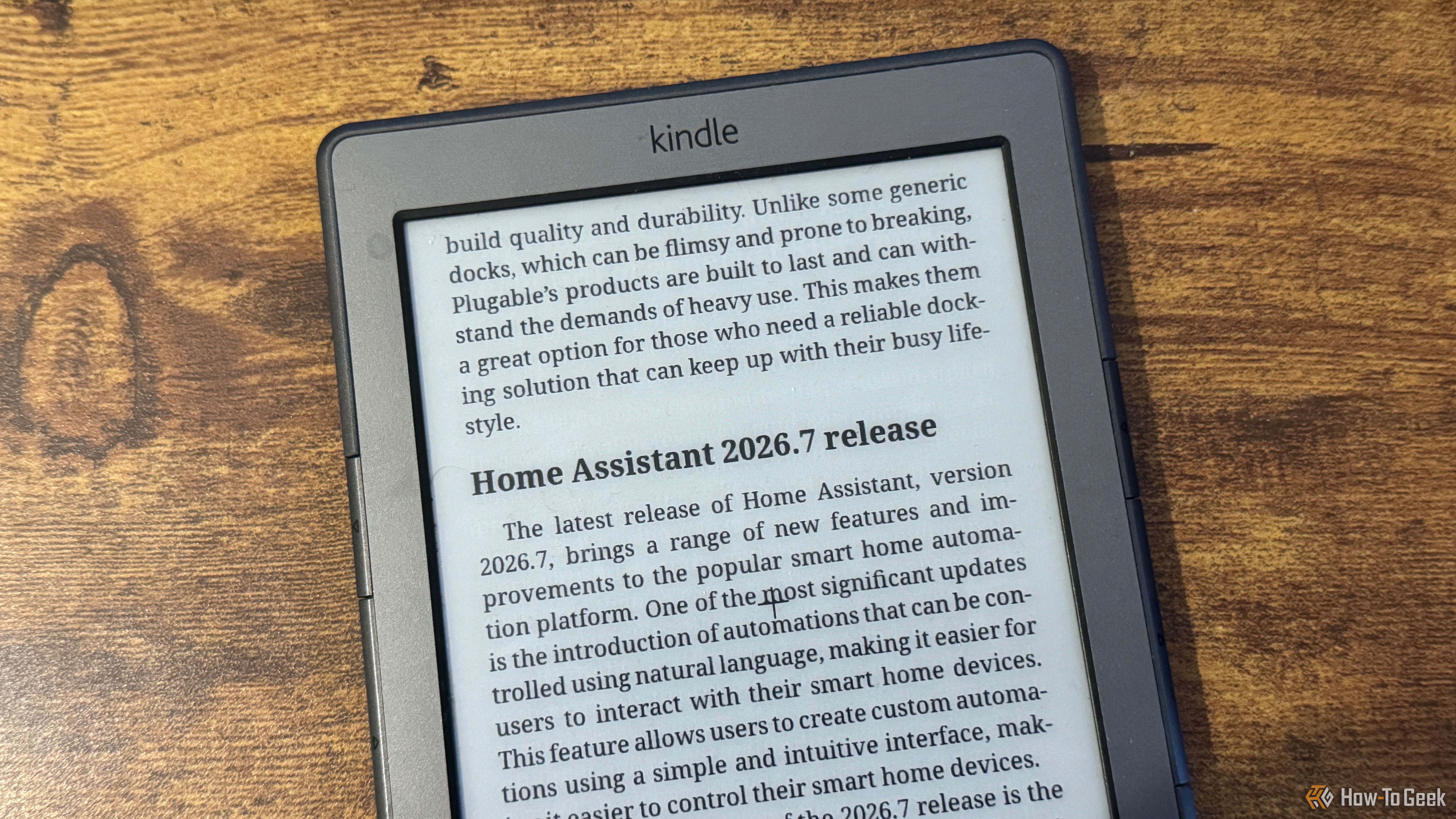 A close up of a Kindle 4 showing the end of the Plugable USBC dock article and the start of the Home Assistant 2026.7 release section.