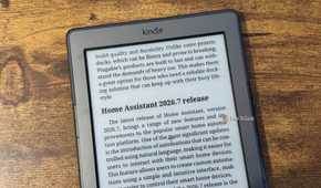 A close up of a Kindle 4 showing the end of the Plugable USBC dock article and the start of the Home Assistant 2026.7 release section.