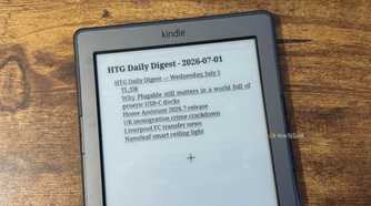 A Kindle 4 tilted on a desk showing the HTG Daily Digest for July 1 2026 title page with a bulleted headline list.