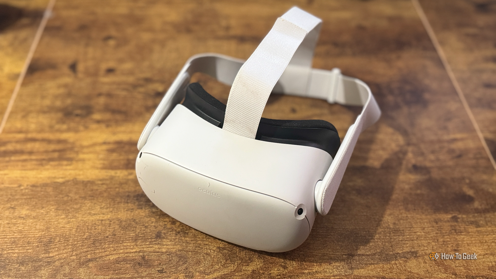 A Meta Quest 2 VR headset on a desk.