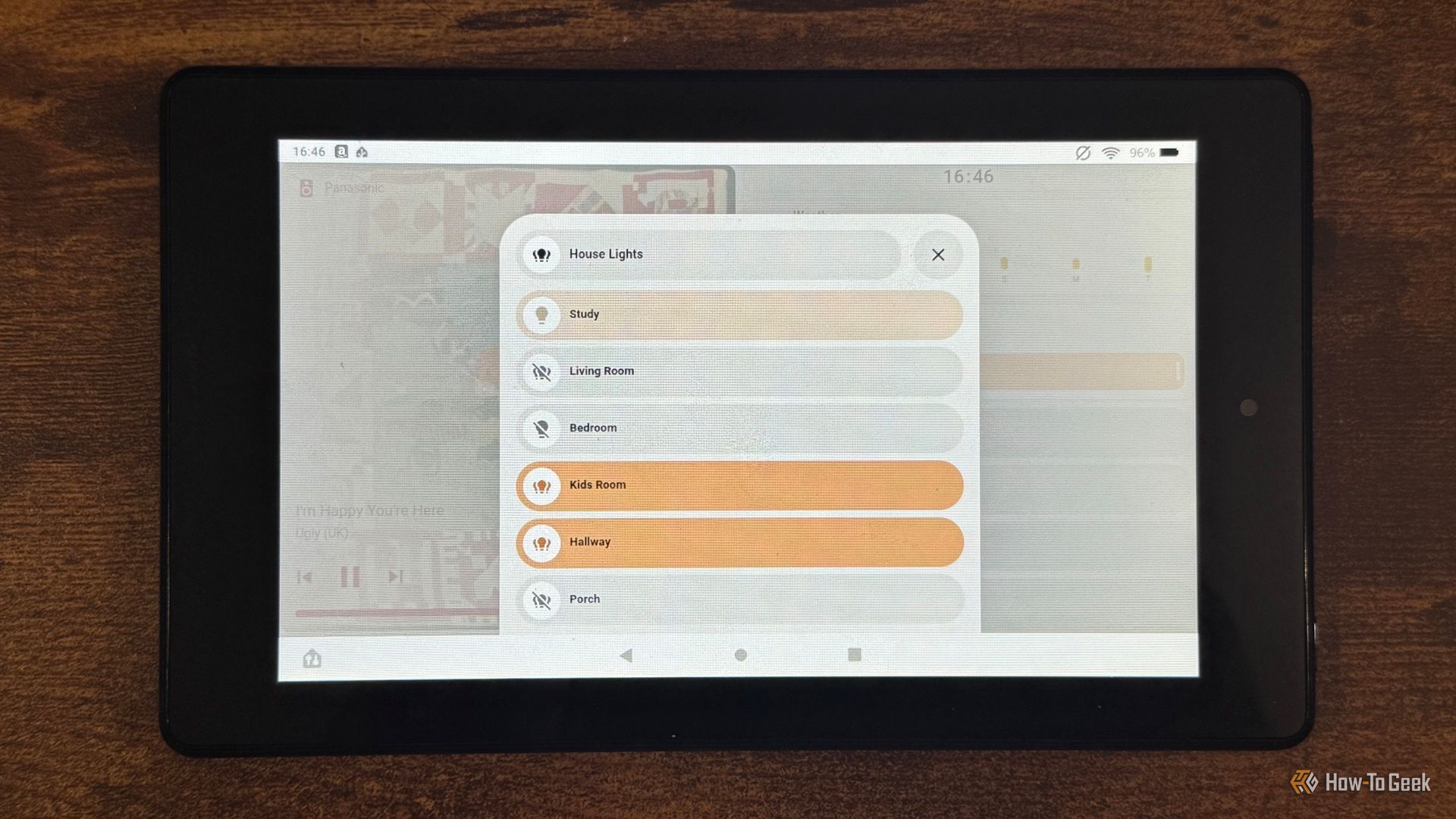 A tablet showing the Home Assistant House Lights list with Study Living Room Bedroom Kids Room Hallway and Porch.