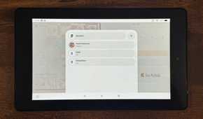 A tablet showing the Home Assistant Speakers list with Desk Panasonic Study and Dining Room photographed closer.