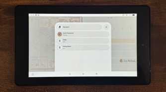 A tablet showing the Home Assistant Speakers list with Desk Panasonic Study and Dining Room photographed closer.