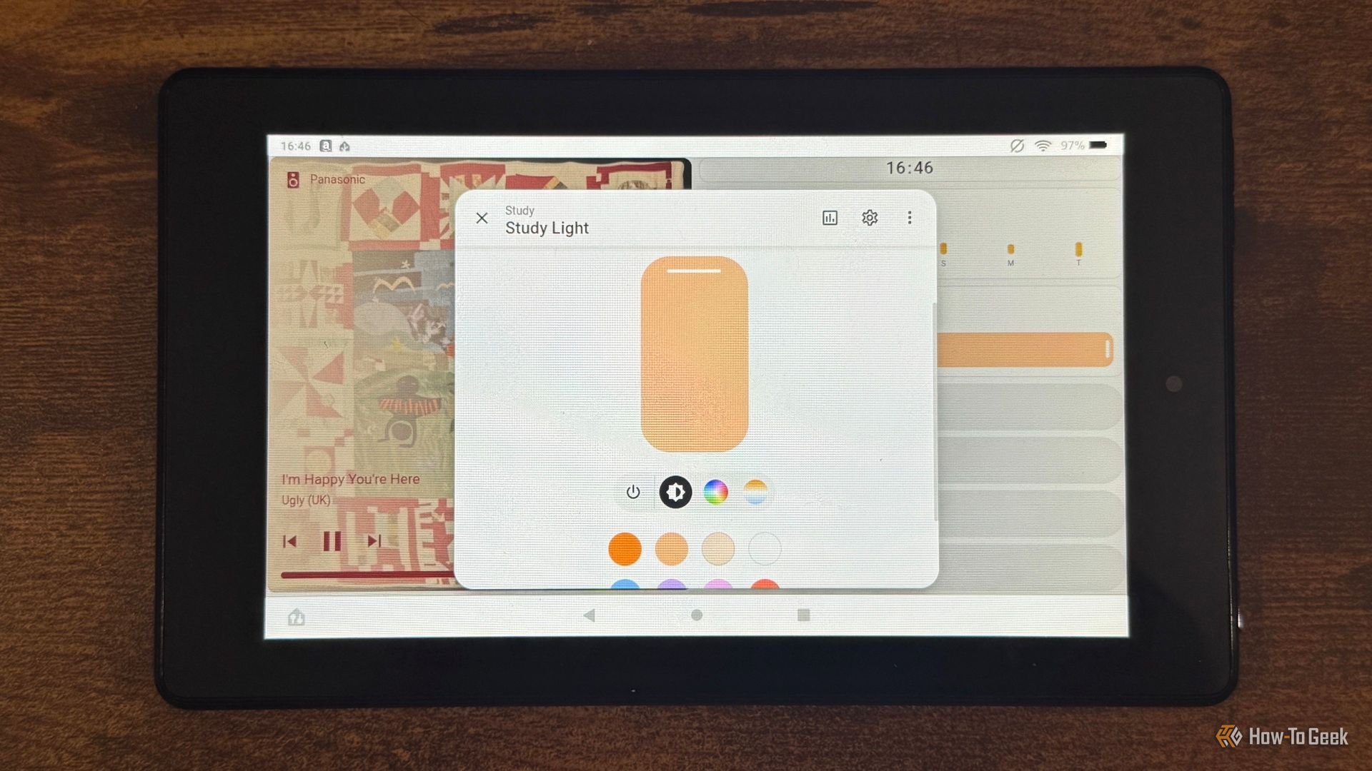A tablet showing the Home Assistant Study Light card with brightness and color options.