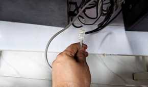 An Ethernet cable ready to be plugged in.
