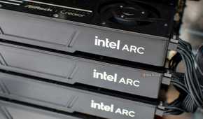 Closeup of several Intel Arc GPUs stacked on one another