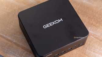 GEEKOM IT13 Max mini PC top and front ports with GEEKOM logo.
