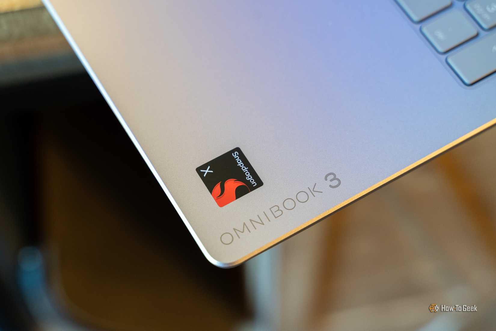 HP OmniBook 3 Snapdragon X badge and chassis branding close-up.