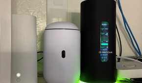 The AmpliFi Alien router next to the Dream Router 7 and AT&T Wi-Fi 6 router.