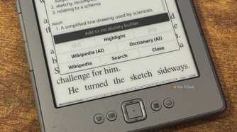 Kindle dictionary popup defining schematic with Wikipedia AI and Dictionary AI options.
