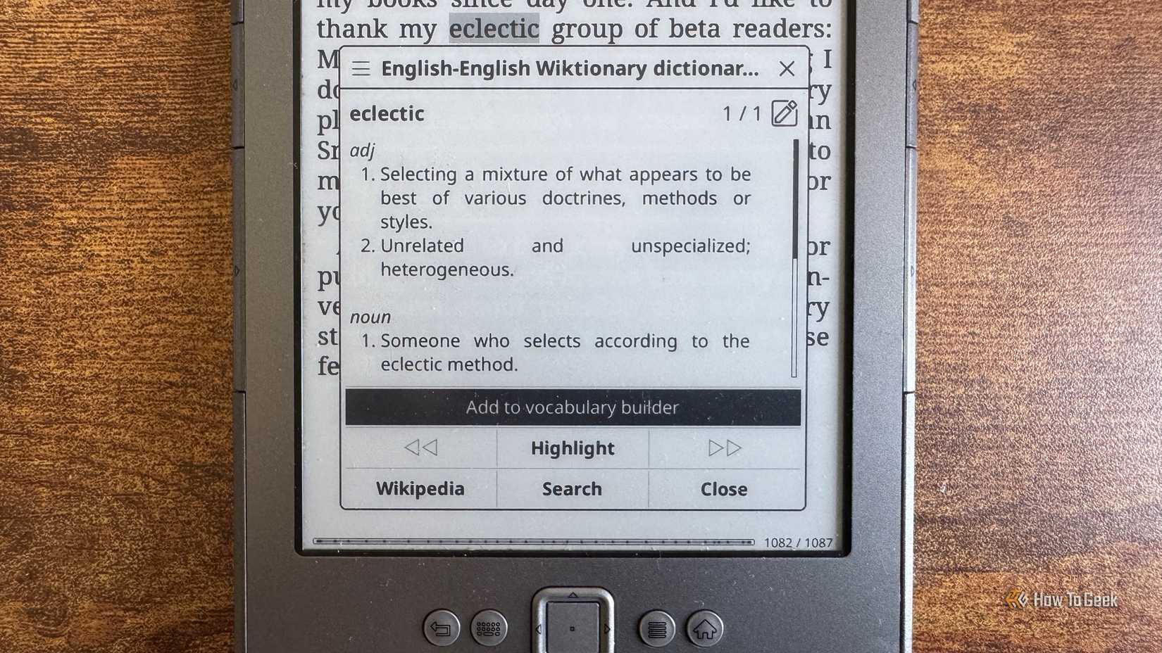KOReader dictionary popup showing the definition of eclectic with an Add to vocabulary builder option.