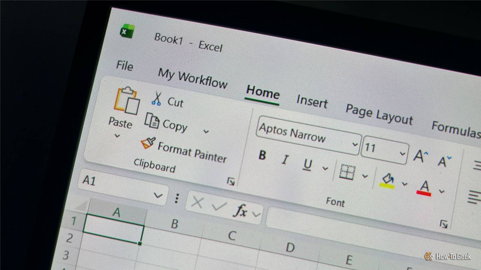 Laptop screen displaying the Excel ribbon with a custom tab named My Workflow.
