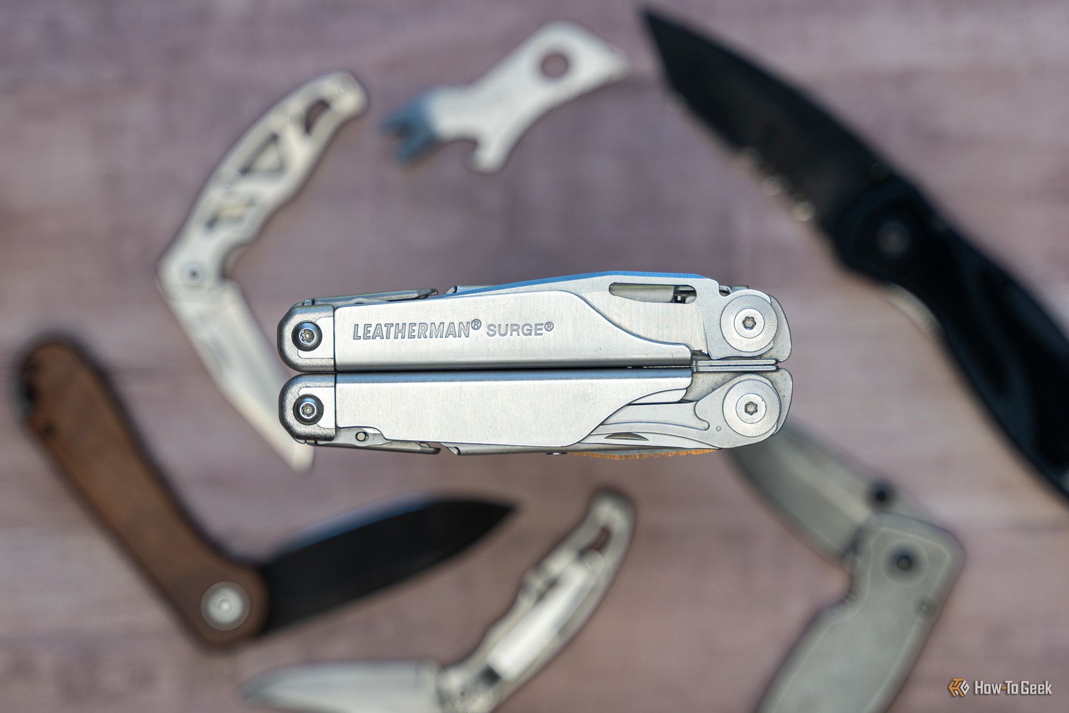 Leatherman Surge multitool folded with stainless steel handles.
