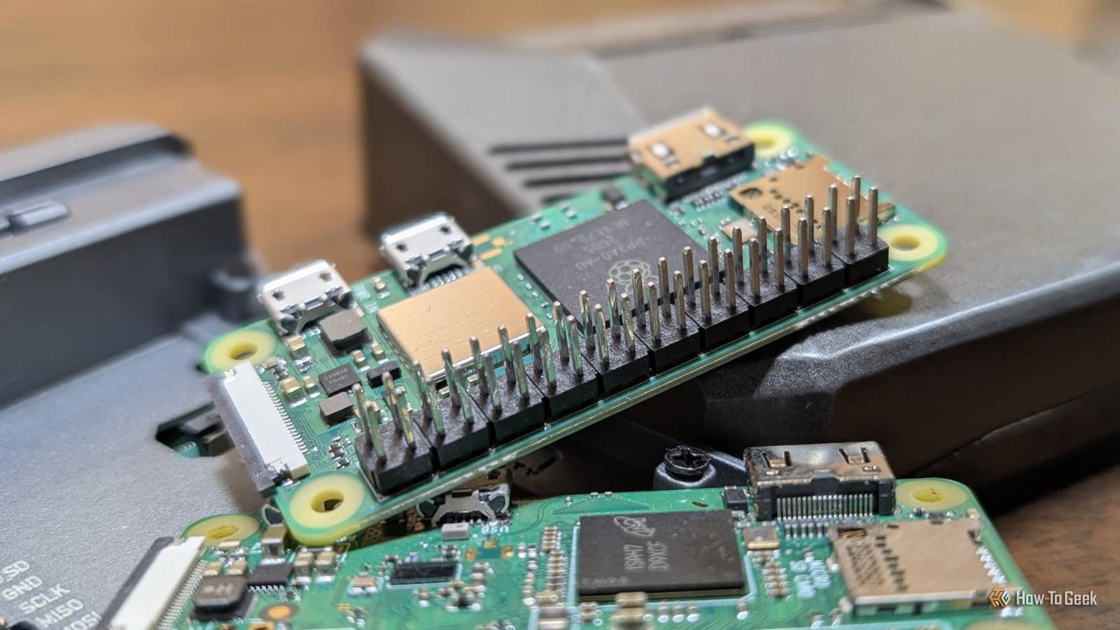 A Raspberry Pi Zero 2 W on top of two Pi 4s and a Pi Zero.
