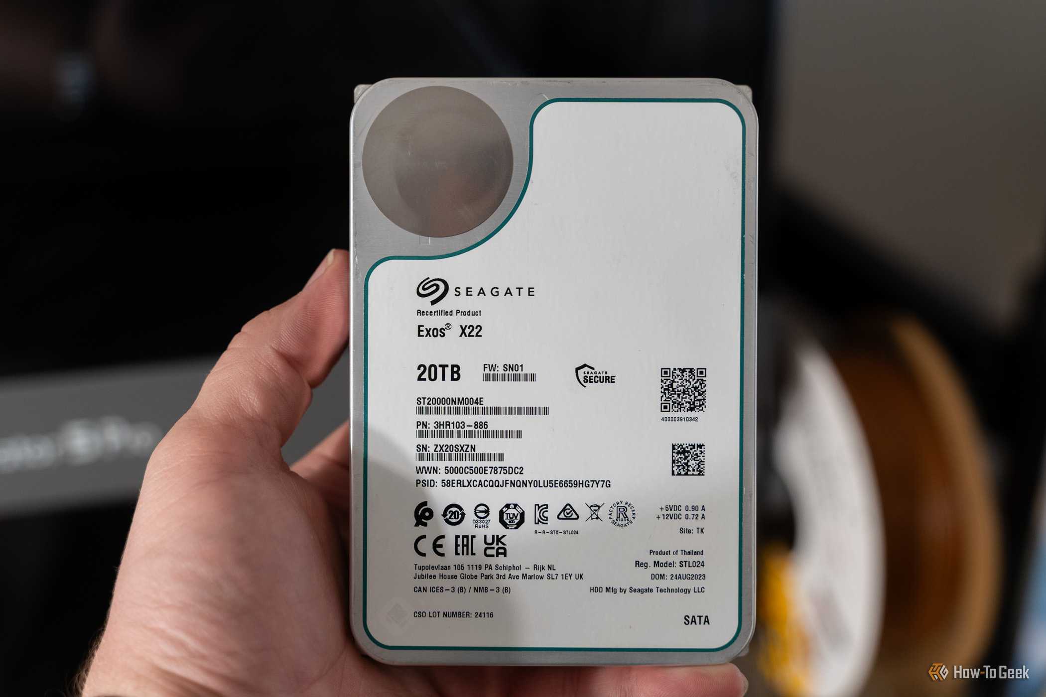 Seagate Exos X22 20TB recertified SATA hard drive held in hand.