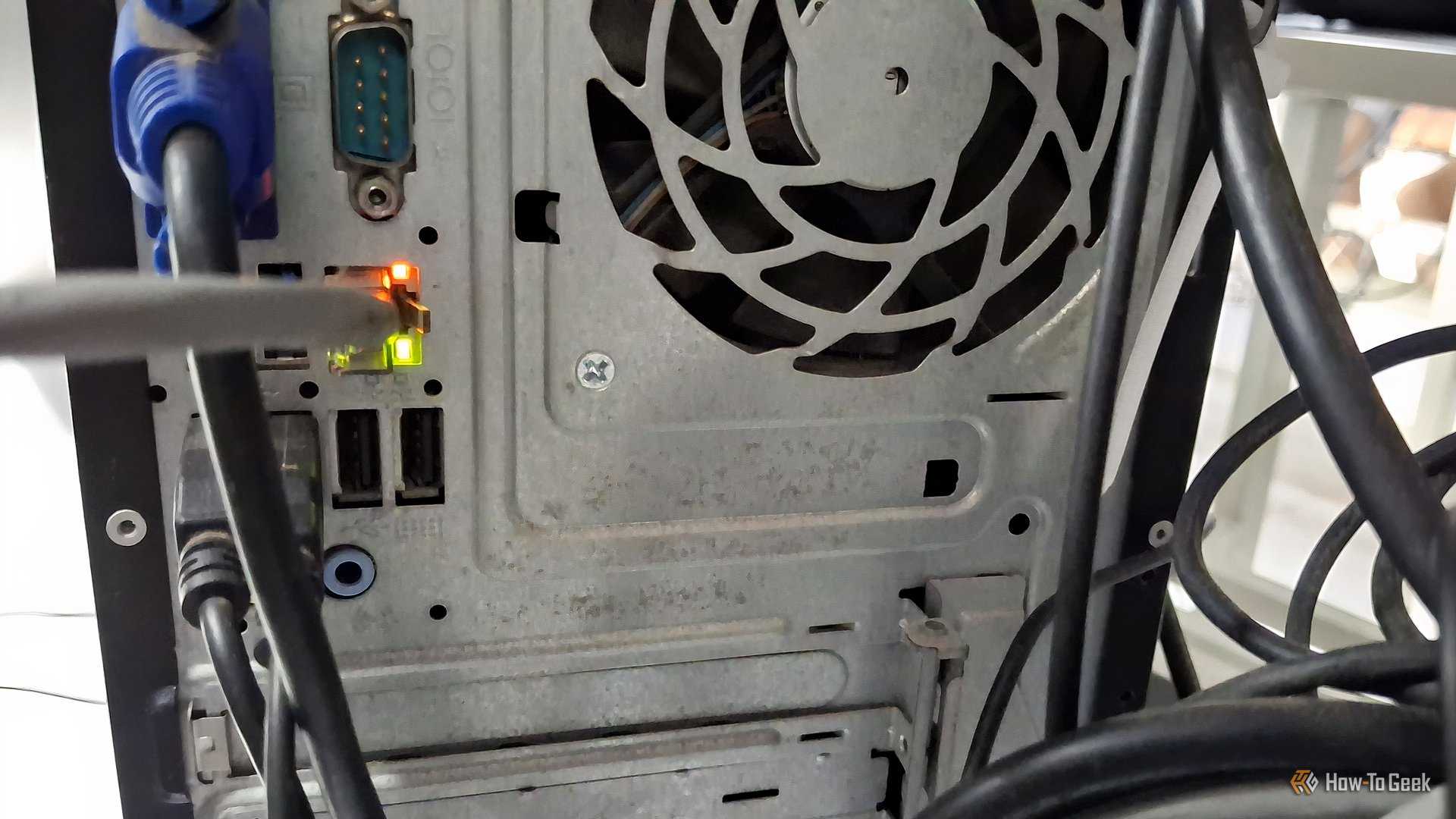 The Behind Ports Of A Desktop With Some Cables Including An Ethernet Ca…