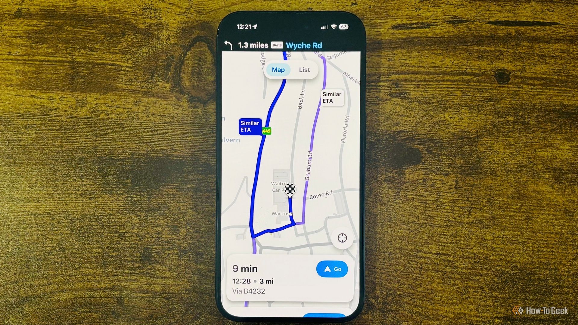 Waze running on an iPhone with a close up showing a 9 minute route to Waitrose and Partners with a Similar ETA alternate route highlighted.