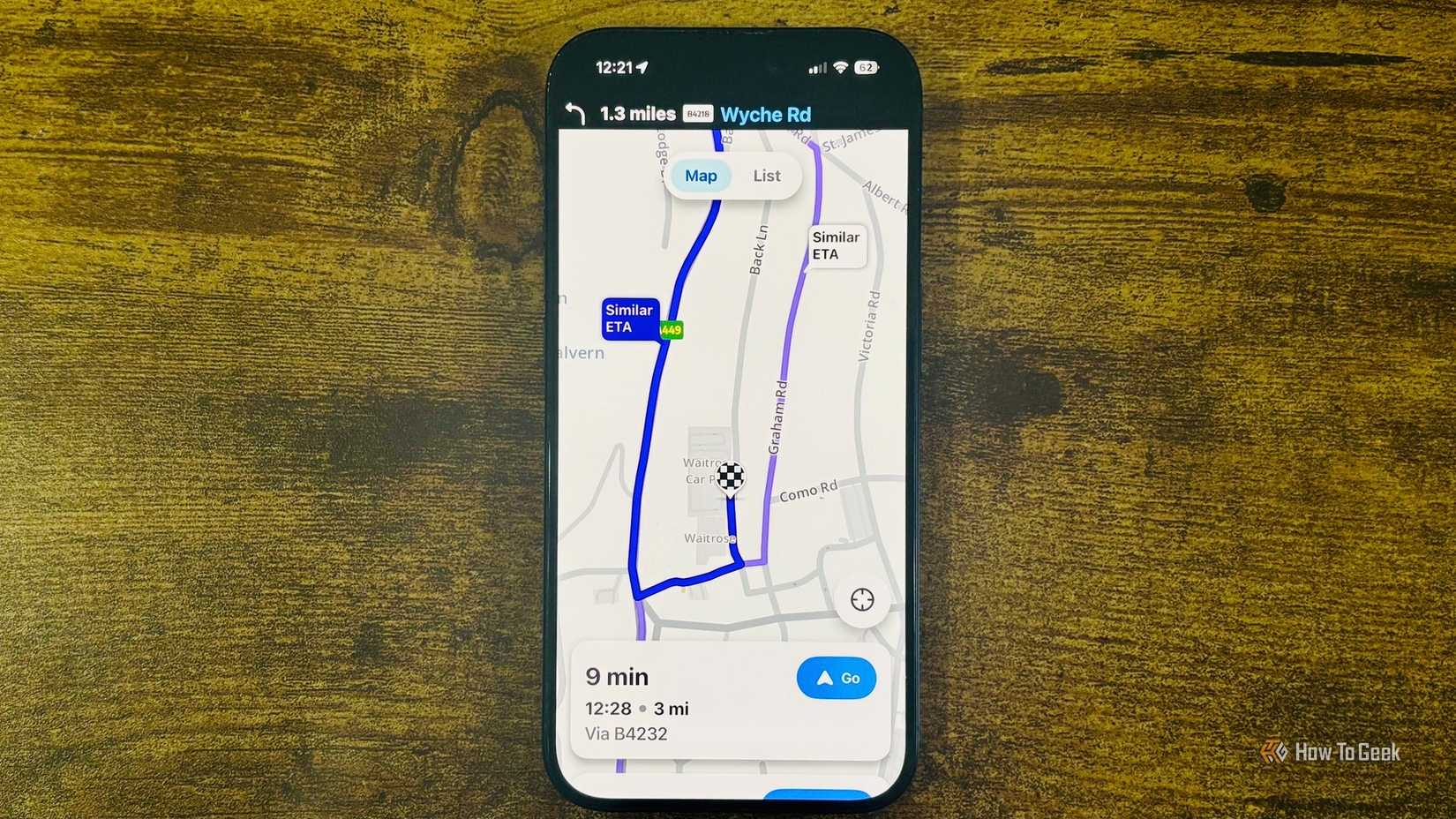 Waze running on an iPhone with a close up showing a 9 minute route to Waitrose and Partners with a Similar ETA alternate route highlighted.