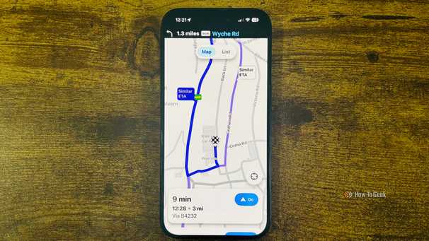 Waze running on an iPhone with a close up showing a 9 minute route to Waitrose and Partners with a Similar ETA alternate route highlighted.