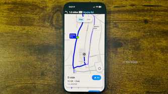 Waze running on an iPhone with a close up showing a 9 minute route to Waitrose and Partners with a Similar ETA alternate route highlighted.