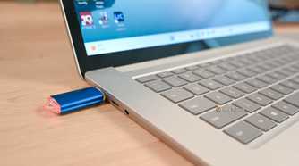 USB thumb drive plugged into a Surface Laptop.