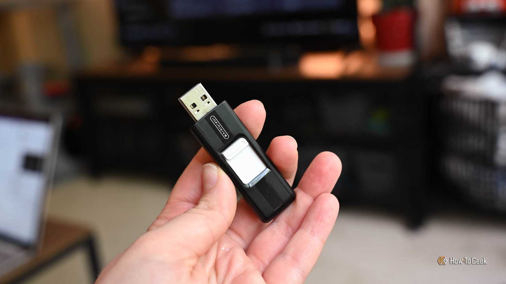 Person holding a USB thumb drive.