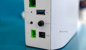 Power barrel jack and USB ports on the back of the BE7200 Dual Band WiFi 7 XGS PON VoIP Router.