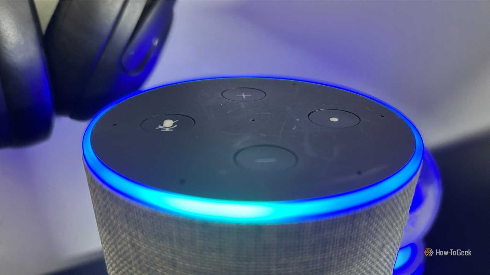 Close-up of an Amazon Echo Gen 2 with the light ring indicator lit up.