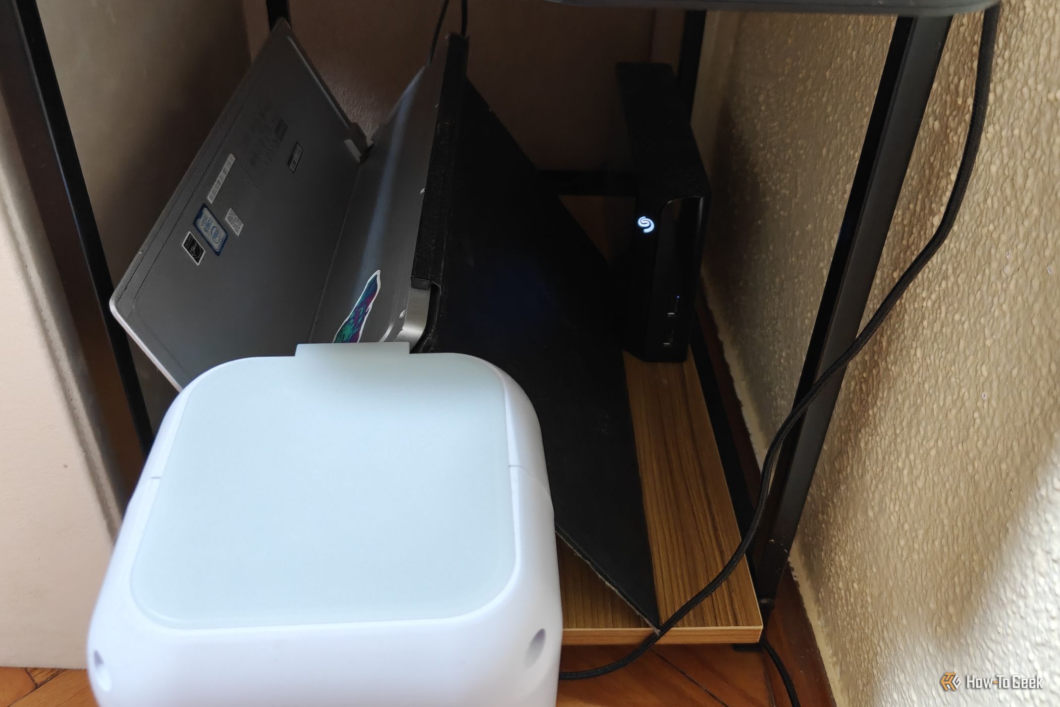 An evaporative USB cooler next to a home server.